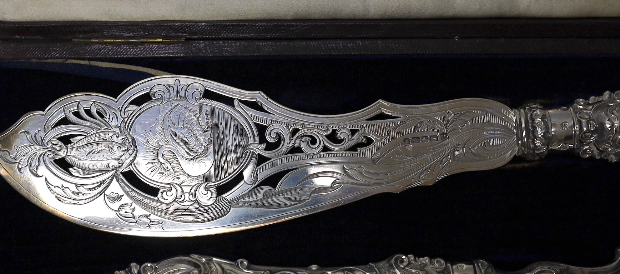 A cased pair of ornate Victorian silver fish servers, Martin, Hall & Co, Sheffield, 1856, knife 35.8cm.